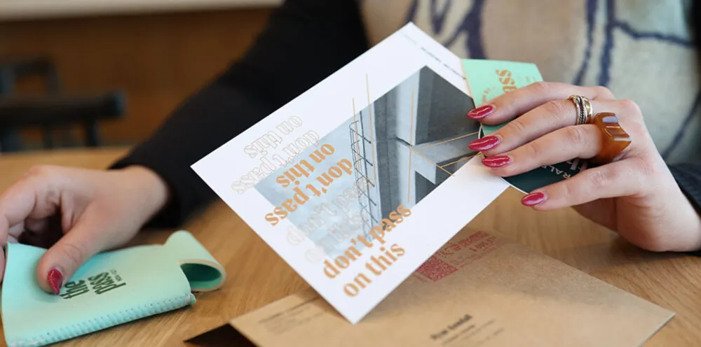 A woman assembling a marketing kit.